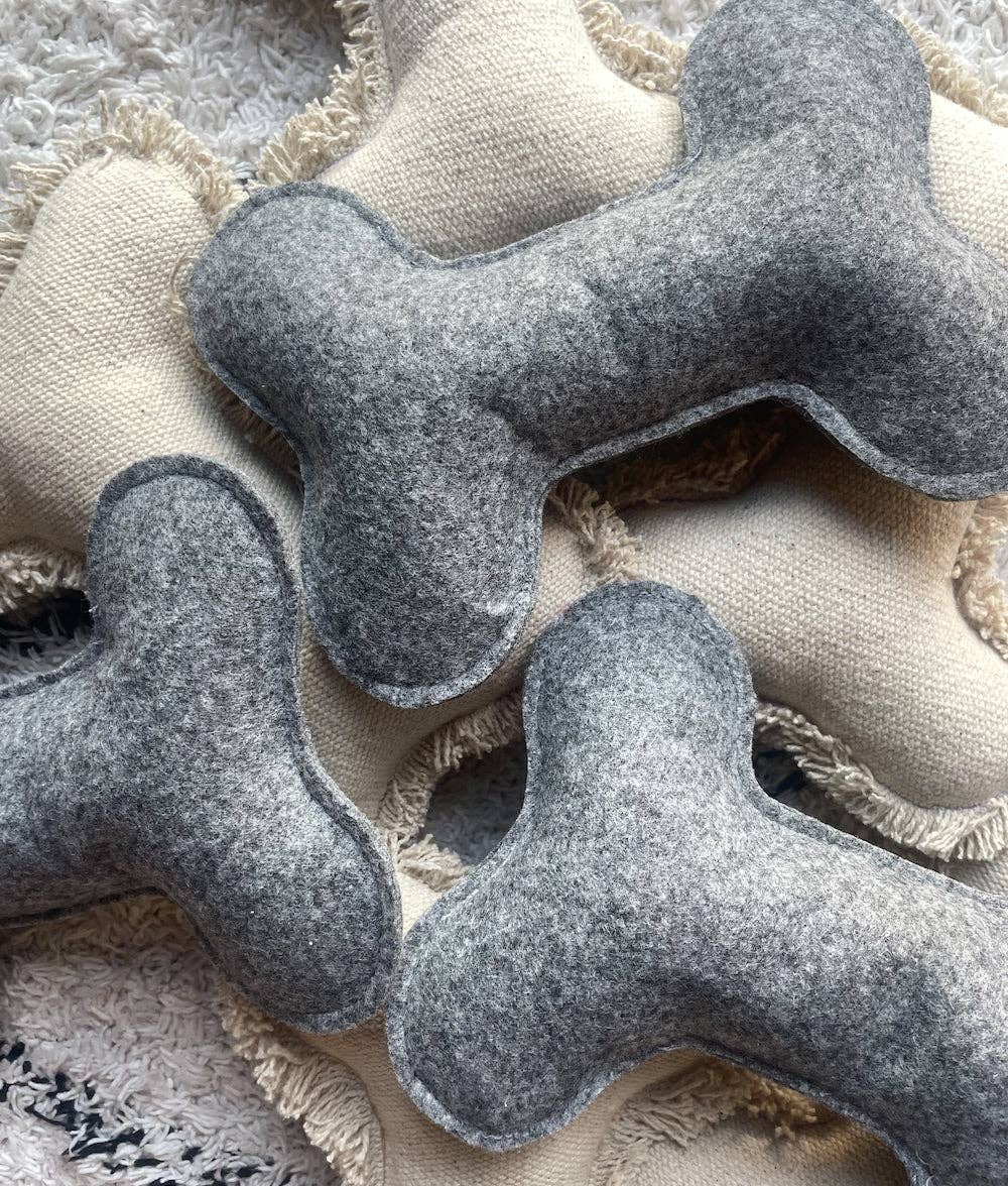 Jouet pour chien beige en forme d’os